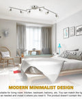 Six-Head LED Track Lighting Kit In Brushed Nickel With Adjustable Foldable Arms GU10 Base Ceiling Spotlights in a modern bedroom
