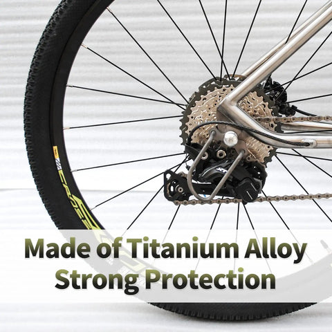 Beefy Titanium Rear Derailleur Guard Rack Protector for Mountain and Road Bikes shown on a bicycle wheel.