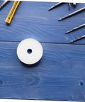 Heavy Hitter Nylon Pulley Wheels With Precision Ball Bearings Smooth Gliding Caster Rollers placed on blue wood surface.