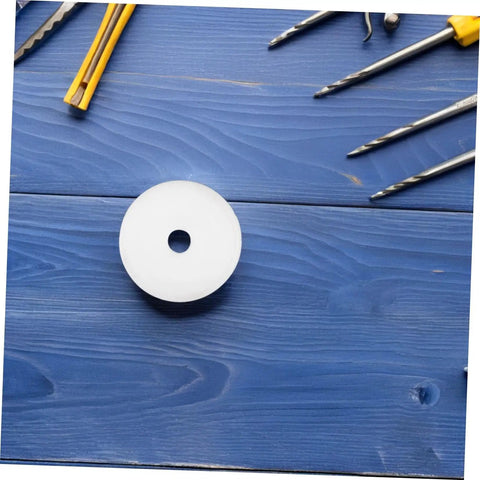 Heavy Hitter Nylon Pulley Wheels With Precision Ball Bearings Smooth Gliding Caster Rollers placed on blue wood surface.