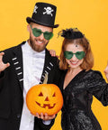Two people wearing Heart Shaped Neon Green Sunglasses For Women And Men Unisex Rimless Glasses at a Halloween event.