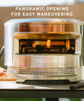 Pi Pizza Oven With Wood Or Gas Burner For Backyard Pizza Nights on table, stainless steel with panoramic opening