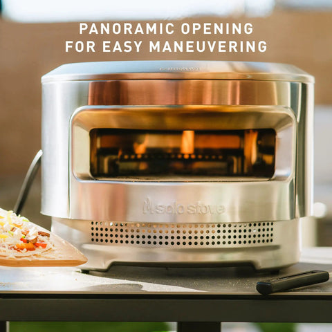 Pi Pizza Oven With Wood Or Gas Burner For Backyard Pizza Nights on table, stainless steel with panoramic opening