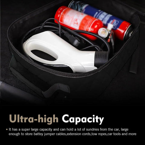 Badass Waterproof Leather Car Jumper Cable Bag Portable Trunk Organizer For EV Charging Cords And Garden Hoses Road Trip Ready showing contents like tools and cords.