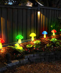 8 Pack Solar Mushroom Lights For Garden Decor With 8 Modes Waterproof Outdoor Mushroom Lamps illuminating a garden path at night