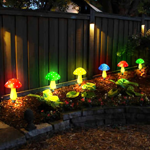 8 Pack Solar Mushroom Lights For Garden Decor With 8 Modes Waterproof Outdoor Mushroom Lamps illuminating a garden path at night