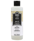 Crack Finish Medium 8 oz bottle labeled, ideal for achieving a sick distressed look to wood and hard surfaces in DIY projects.