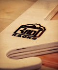Premium Baltic Birch Wall Mount Snowboard Rack And Ski Holder For Four Boards logo detail on the wood surface