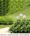 Solar Stake Lights With Color Changing LEDs And Life Size Figurines, Assorted Multicolor Outdoor Garden Decor, 3 Count displayed in garden.