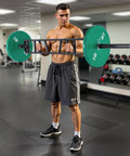 Man using Heavy Duty 2 Inch Swiss Bar With Three Grip Positions Built To Last, Supports Up To 550 Lbs in gym setting