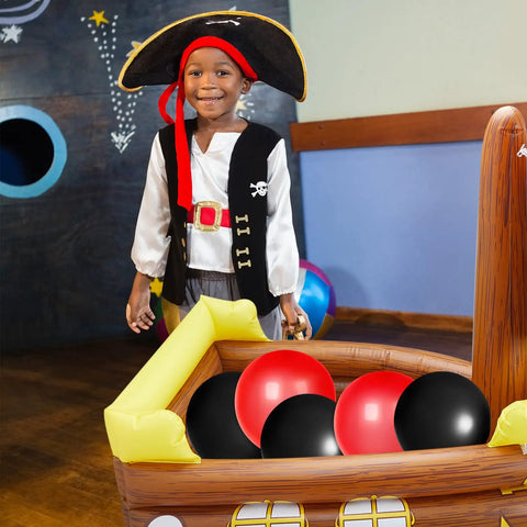Child standing in an inflatable pirate ship cooler for pool parties and Gasparilla decor, with balloons inside as food tray and beverage holder.