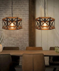 Kickass 14 Inch Black Farmhouse Pendant Light With Plug In Dimmable Switch And Adjustable Woven Cord For Kitchen Island Or Dining Room heavy oak wood and metal cage fixture over a dining table in rustic setting.