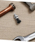 Heavy Duty Tough As Nails Stainless Steel Indexing Plunger With Spring Loaded Knob on a work surface with tools for industrial use.