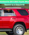 Side view of a red Toyota 4Runner with rear window shades for 2011-2023 models, showing breathable mesh privacy screens.