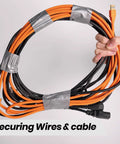 Hand holding cables secured with Heavy Duty Duct Tape 1 Point 88 Inch Wide By 90 Feet Waterproof No Residue Hand Tear Bond.