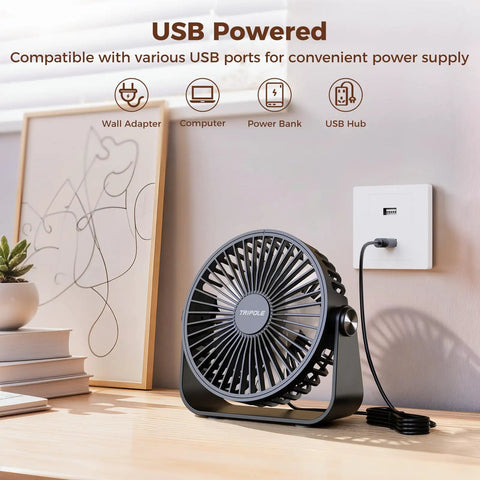 USB Desk Fan Portable Mini Personal Fan with 360 Degree Head on desk, plugged into USB wall adapter, black color.