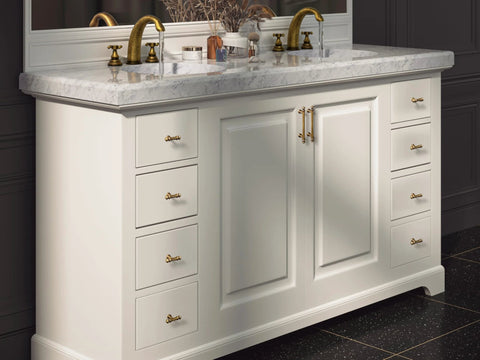 Bathroom vanity with Six Pack 3 Inch Hole Center Cabinet Pulls Antique Brass Zinc Alloy Drawer Handles installed on white cabinet.