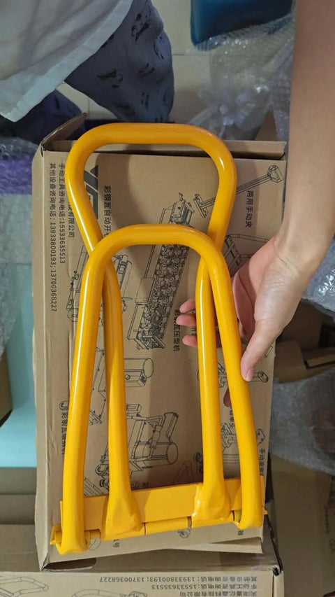 HTSL25E2 Roof Eaves Seam Bender, yellow crimper tool for standing seam metal roofing, hand holding tool above packaging.