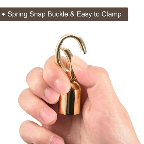 Person holding Gold Cord End Cap Set Of 8 For Tassel Jewelry Making And Bag Strap DIY with spring snap buckle.