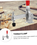 Two Piece Welding Fixed Toggle Clamps With Rubber Tips Pro Grade Heavy Duty Metal Hold Down Clamps in use on wooden bench.