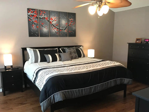 Bedroom with black and white theme, featuring Maxwell Bedside Lamp with USB Port on nightstands, wood frame, cozy LED glow.