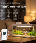 Top Tier Ready Slick Desktop Aquarium Kit With Smart App Control And Built In Auto Feeder 1.3 Gallon Small Fish Tank showing vibrant fish and plants.