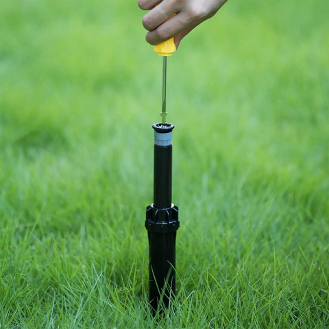 Using Sprinkler Head Adjustment Tool and Rotor Removal Kit on lawn sprinkler
