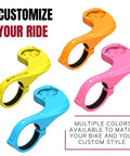 Color variations of Carbon Finish Garmin Bike Mount For Edge 530 And 830 And Other Models in yellow, orange, pink, and blue