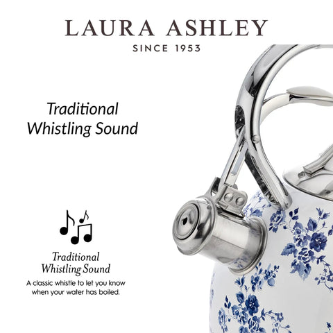 Close-up of a stainless steel stovetop kettle with a floral design, whistle, and cool-touch handle, showcasing its whistling feature.