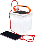 2 In 1 Solar Camping Lantern And Phone Charger With 300 Lumens Of Bright LED Light, Red Night Mode shown charging a smartphone