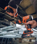 User operating Tough As Nails Badass Cordless Impact Drill With Two Speed Settings And Full Metal Gearbox for metalwork.