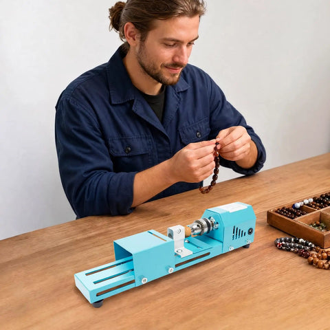 Super Compact Mini Wood Lathe Machine Featuring 96W Motor And Seven Adjustable Speeds Up To 9000Rpm For Precision Turning Punching Engraving Cutting Grinding Polishing Ideal Diy Projects With Lightweight Metal Body And Quick Change Chuck For Easy Setup, used for bead crafting by a man on a wooden table.