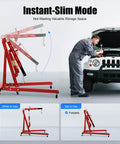 Heavy Duty Hydraulic Engine Hoist, 2 Ton Folding Shop Crane built tough, shown in use lifting a vehicle engine with adjustable arms.