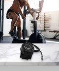 Fine Tuned Resistance Rotary Adjuster for Exercise Bike with Eight to Ten Gear System on gym floor, cable visible
