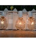 G40 Replacement Light Bulbs 120V 5W Clear Globe Bulbs For Indoor And Outdoor Vibes Patio String Lights illuminated on fence