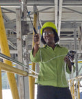 Sampling Line With Quick Disconnect For ALTAIR 5X Pump Probe in use by technician in field, showing portable gas monitor setup.