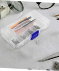 Eyeglass Repair Kit With Screws Screwdriver Tweezers Sunglasses Nose Pads Ear Hooks And Cleaning Cloth For Quick No Fuss Glasses Fixes Durable Diy Tool Set For Beginners To Pros in transparent case on table