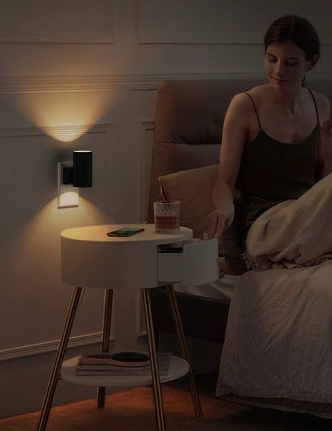 L LOHAS LED plug-in night light on wall; black top, white base, dusk-to-dawn sensor, warm white 3000K, 2-pack