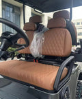 Interior view of White 4 Seater Electric Golf Cart Featuring Flip Up Seats 48 Volt 150 Amp Hour Lithium Battery And Backup Camera.