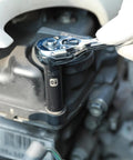 Mechanic using 50 Piece 1 Quarter Inch Drive Master Heavy Duty Impact Socket Set for SAE and Metric during vehicle maintenance