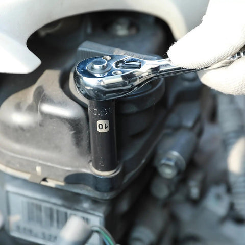 Mechanic using 50 Piece 1 Quarter Inch Drive Master Heavy Duty Impact Socket Set for SAE and Metric during vehicle maintenance