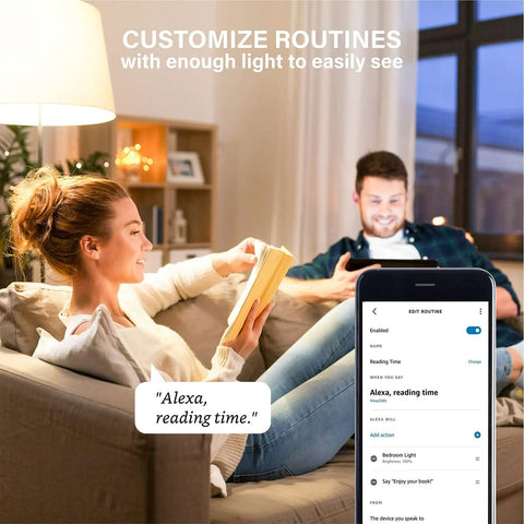 Couple using Alexa Compatible Smart Light Bulbs 100W Equivalent in living room, phone app controls lighting routine.