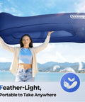 Woman holding Inflatable Lounger Couch Air Sofa Hammock No Pump Needed 20 Second Inflation Waterproof Beach Chair for outdoor use.