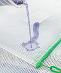 Close-up of a 24 Pack Small Mesh Zipper Pouches With Label Pocket Waterproof Bags, showing water resistance feature with liquid on surface.
