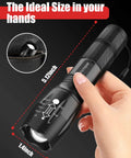 Person holding an Ultra Bright LED Flashlight Six Pack With 2000 Lumens Five Modes Waterproof Zoom Focus Beams Portable Outdoor Flashlights For Camping Hiking Home And Emergency, showing ideal hand size and dimensions.