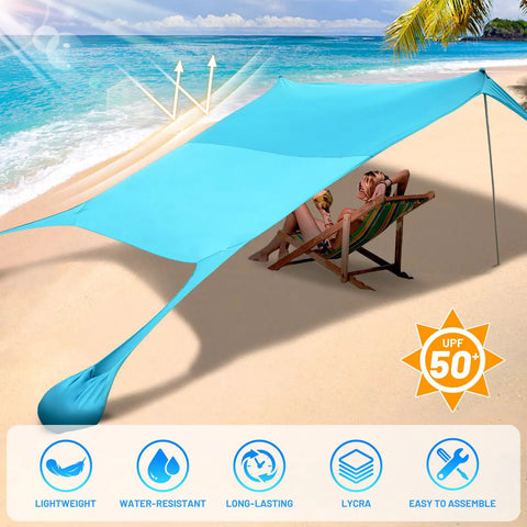 Pop Up Beach Tent Sun Shelter Grande 10x10ft Canopy With 4 Stability Poles on sandy beach with couple relaxing underneath