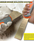 Aluminum bronze wallpaper scraper removing texture with gray and orange handle