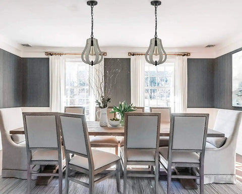Dining room with two Vintage Wood Pendant Lights With Distressed White Finish, highlighting rustic swag style and metal wood construction.