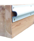 Rock Solid C Shape Dock Edge Guard 10 Foot Roll Of Heavy Duty Co Extruded Pvc Profile mounted on wood for dock edge protection.