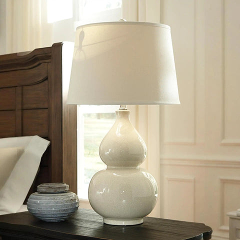 Cream Ceramic Table Lamp With Fabric Shade, Double Gourd Base, 3-Way Switch, UL Listed, Transitional Accent Lighting For Living Room Or Bedroom, 29.75 Inch Tall, Cozy Yet Classy next to a bed.